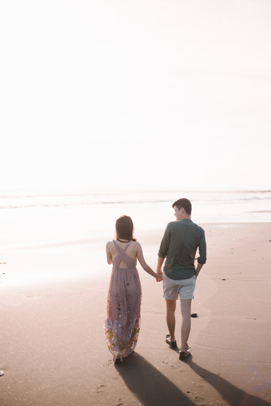 Man and Woman Walking on Beach